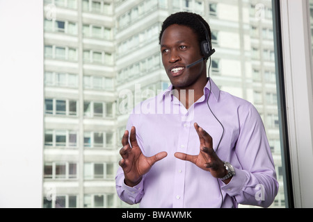 Businessman talking on telephone headset Stock Photo