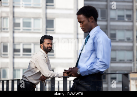 Two businessmen thinking before work Stock Photo