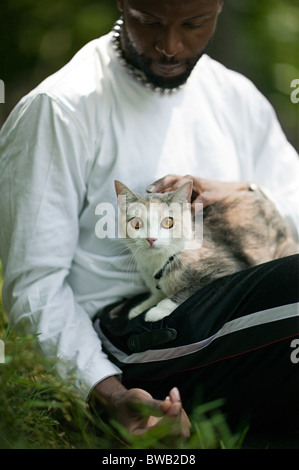 Man petting his cat Stock Photo