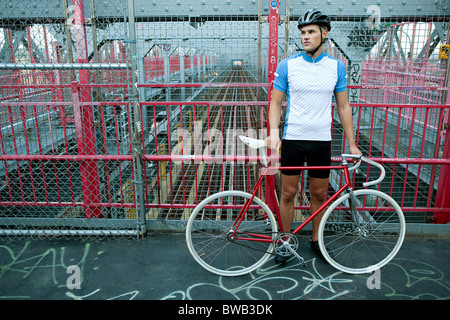 Cyclist on bridge Stock Photo