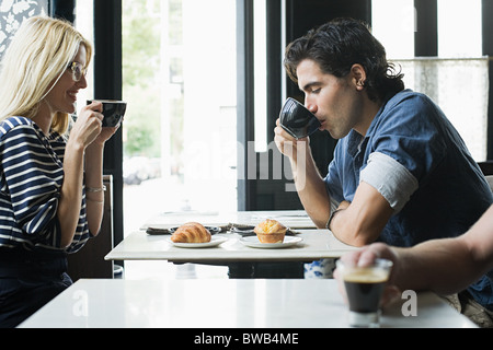 Couple having coffee in cafe Stock Photo