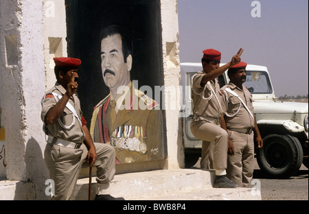 Southern Iraq Ba'ath regime checkpoint, Iraqi Security services salute the portrait of the President, Saddam Hussein and Ba'ath Stock Photo