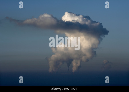 Giant steam clouds rising from the cooling towers at Drax coal fired power station, Selby, Yorkshire, UK. Stock Photo