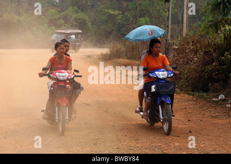 Teenage girls on a scooters, Ban Houayxay, Bokeo Province, Laos. Stock Photo