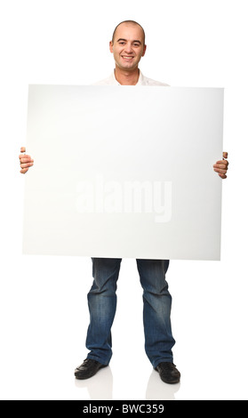caucasian young standing man holding white board isolated Stock Photo