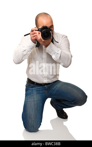 young photographer at work isolated on white background Stock Photo