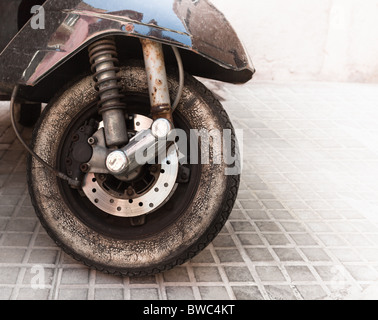 close up motorcycle black rear shock absorber suspension. dirty