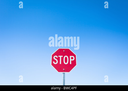 Stop sign against blue sky Stock Photo