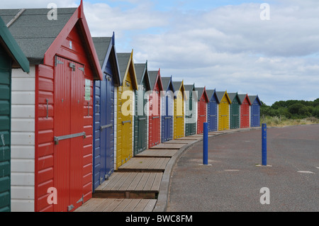 Brightly coloured  beach huts at Dawlish Warren, Devon Stock Photo