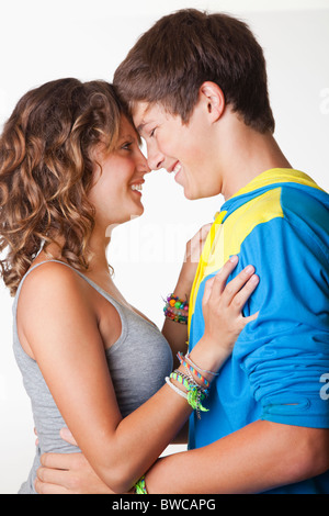 USA, California, Fairfax, Teen (14-17) couple embracing, against white background Stock Photo