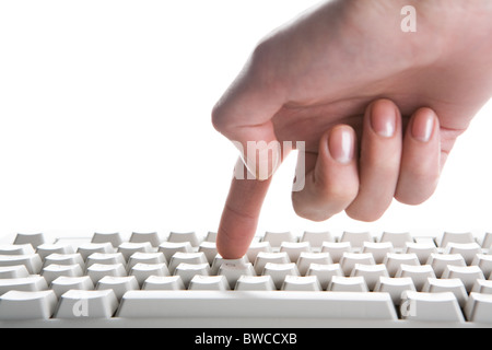 Image of human forefinger on keyboard button over white background Stock Photo