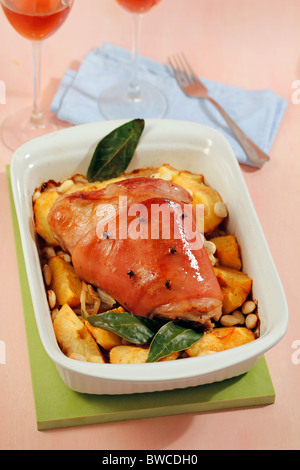 Knuckle of pork with quince and almonds. Recipe available. Stock Photo