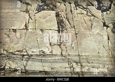 Surface of a natural stone with stains and cracks - a background Stock Photo