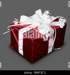 New Year's gift in a red box with a ribbon on a gray background Stock Photo