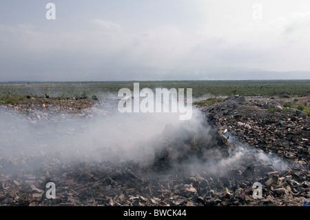 Trash burning in a garbage dump Haiti Stock Photo