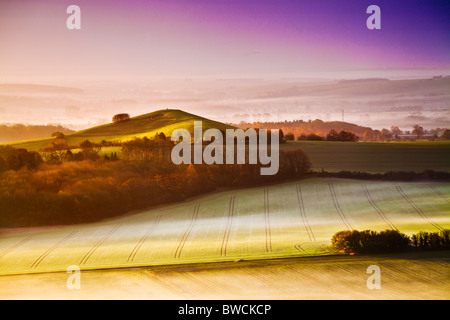 Misty autumn sunrise from Knapp Hill over the Vale of Pewsey in Wiltshire, England, UK Stock Photo