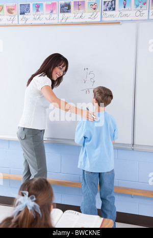 USA, Illinois, Metamora, Teacher and students (8-9) in classroom Stock Photo