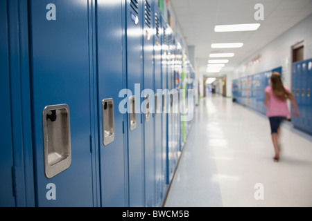 USA, Illinois, Metamora, Schoolgirl (8-9) walking in school corridor Stock Photo