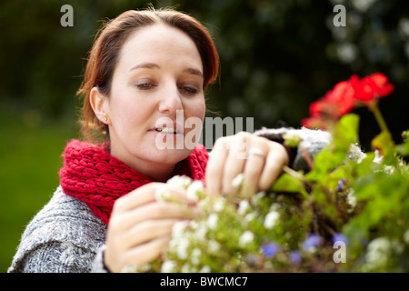 Portrait of woman with flowers Stock Photo