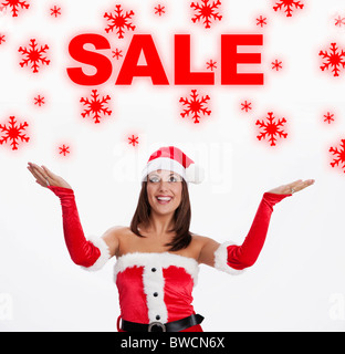 USA, Illinois, Metamora, Woman wearing Santa costume looking at sale sign Stock Photo