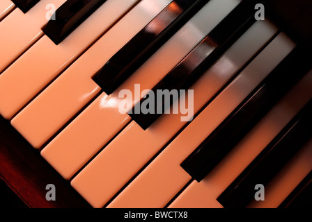 Piano keys close up using warm photo filter. Playing with light. Stock Photo