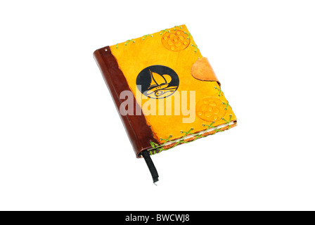 Brown book in leather cover isolated on white background. Stock Photo