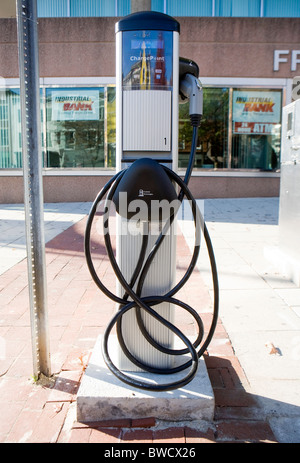 An electric car charging station and parking space.  Stock Photo