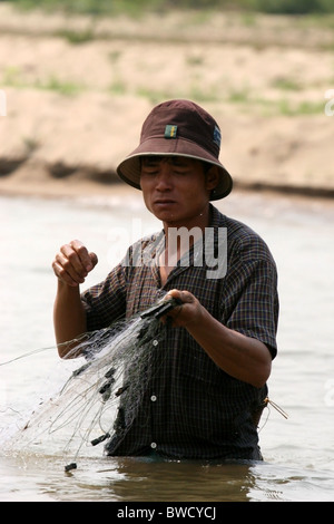 Fisherman on the banks of the Kok River, Northern Thailand. Stock Photo