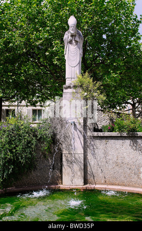 Fountain Statue of Saint Denis, Square Suzane-Buisson, Montmartre, Paris, France Stock Photo