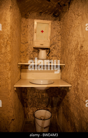A private cubicle with period furniture in a former underground bomb shelter now opened as a historic attraction in Malta. Stock Photo