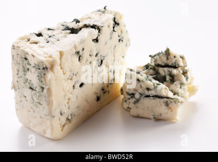 Pieces of blue cheese on a white background. Stock Photo