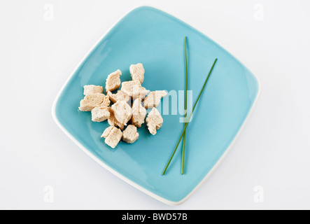 Fresh raw Quorn on blue plate Stock Photo