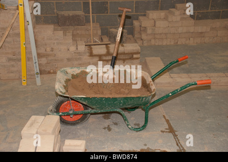 wheelbarrow & bricks in a construction training academy Stock Photo