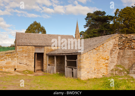 The old convict built stables in the historic town of Ross stand near the village church Stock Photo