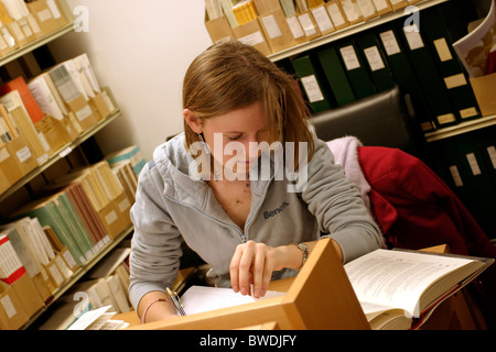 Student working/studying/researching in a library Stock Photo