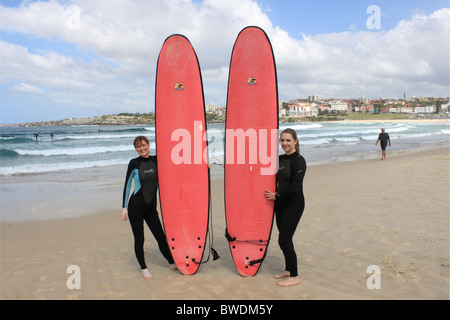 Mother and daughter surfers on Bondi Beach, Sydney, New South Wales, NSW, east Australia, Australasia Stock Photo