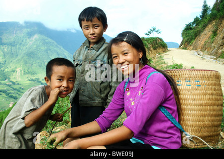 Two Hmong kids and their sister in Sapa, Vietnam Stock Photo