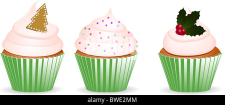 Set of three cupcakes with green wrappers and Christmas decorations Stock Photo