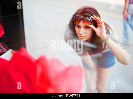 Young woman window shopping Stock Photo