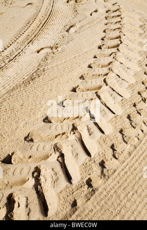 Tyre tracks in the sand. Stock Photo