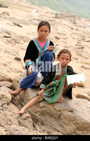 Hmong Child playing on the banks of the Mekong river between Pakbeng and Luang Prabang, Laos. Stock Photo