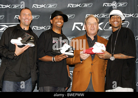 Daddy Yankee poses looks at his new sneaker at the Reebok RBK Now Playing  press conference at Marquee in New York City on March 8, 2006. (UPI  Photo/John Angelillo Stock Photo - Alamy