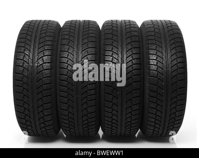 Set of four winter tires isolated on white background Stock Photo