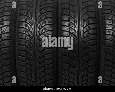 Closeup of a winter car tires background texture
