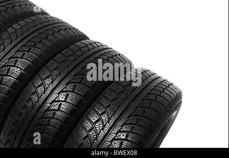 Set of four winter tires isolated on white background Stock Photo