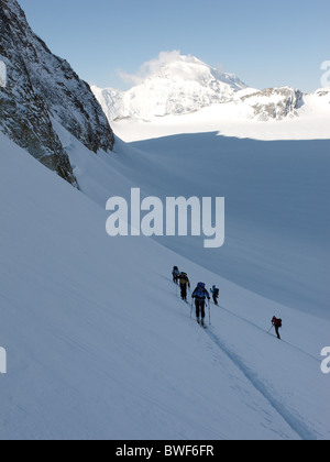 Ski tourers on Mont Blanc de Cheilon in winter, Switzerland Stock Photo