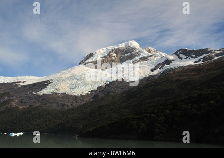 Pyramidal peak with ice cascades and meltwater streams rising above Lake Argentino, near the Spegazzini Glacier, Patagonia Stock Photo