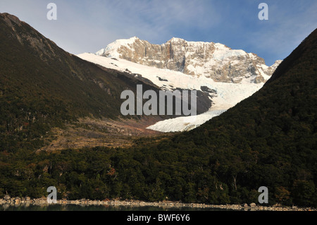 Tributary glacier, snow peaks source to terminus, in a 'hanging valley' above Lake Argentino, near Spegazzini Glacier, Patagonia Stock Photo