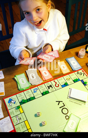 Girl playing Monopoly