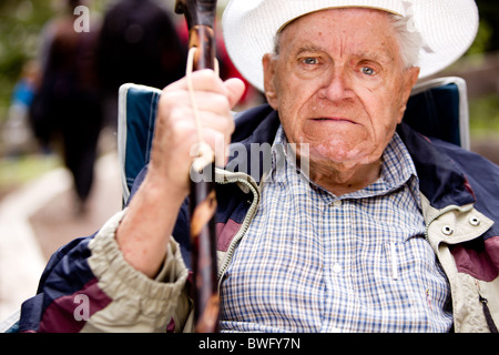 An angry old man with his fist up and unhappy face Stock Photo